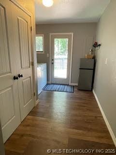 25961 S 621st Rd, Grove, OK 74344 - doorway featuring wood finished floors and baseboards