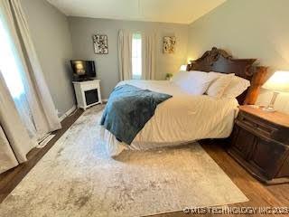 25961 S 621st Rd, Grove, OK 74344 - bedroom featuring wood finished floors and lofted ceiling