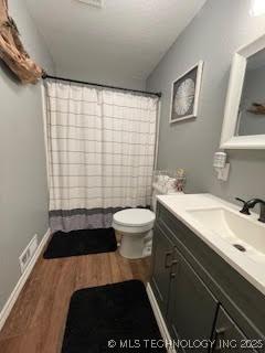 25961 S 621st Rd, Grove, OK 74344 - bathroom featuring vanity, wood finished floors, and a shower with shower curtain