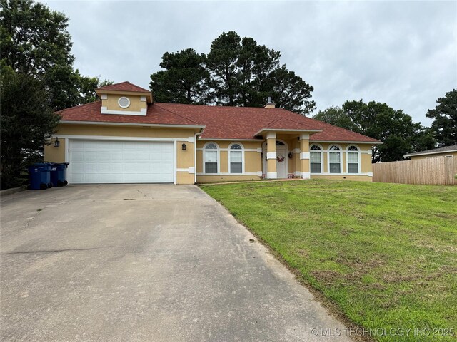 607 Nelson, Mcalester, OK 74501 - view of front of house with driveway, stucco siding, and a garage