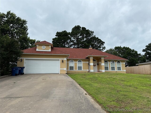 607 Nelson, Mcalester, OK 74501 - view of front of property with driveway, stucco siding, and a garage