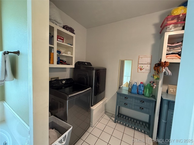607 Nelson, Mcalester, OK 74501 - laundry area with washing machine and clothes dryer and light tile patterned floors