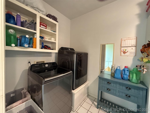 607 Nelson, Mcalester, OK 74501 - washroom featuring washer and dryer and light tile patterned flooring
