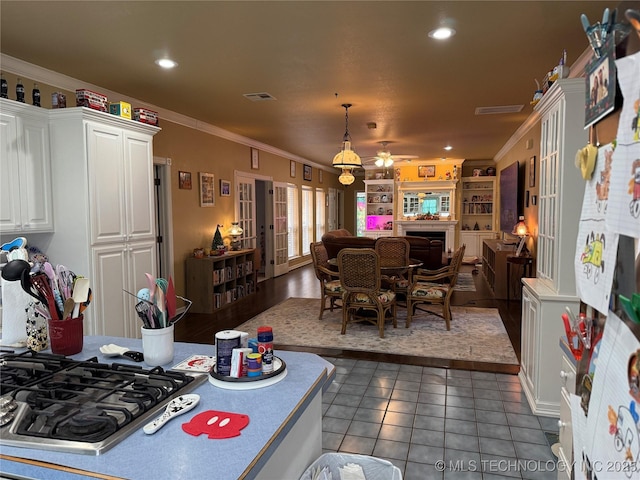 607 Nelson, Mcalester, OK 74501 - kitchen with french doors, crown molding, white cabinetry, open floor plan, and tile patterned floors