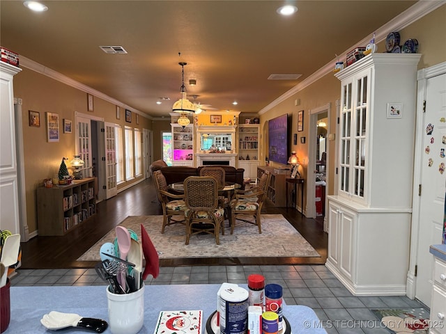 607 Nelson, Mcalester, OK 74501 - dining area featuring dark tile patterned floors, crown molding, french doors, and recessed lighting