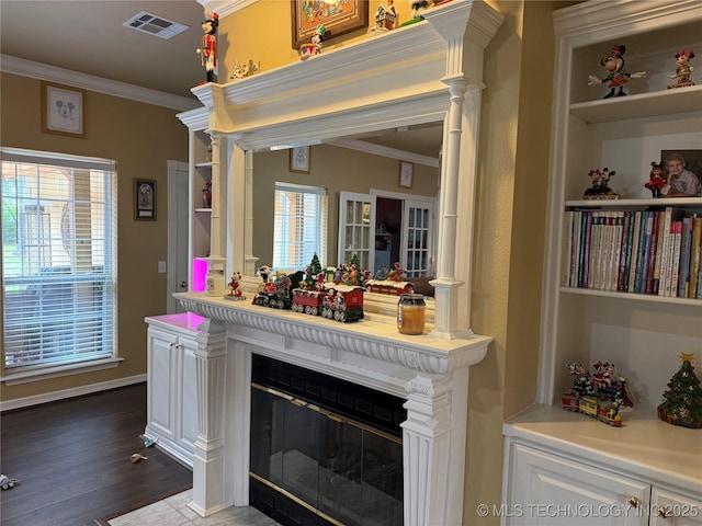 607 Nelson, Mcalester, OK 74501 - detailed view of ornamental molding, ornate columns, wood finished floors, and a glass covered fireplace