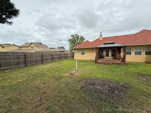 607 Nelson, Mcalester, OK 74501 - fenced backyard featuring a gazebo and a deck