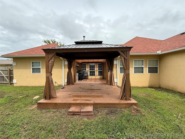 607 Nelson, Mcalester, OK 74501 - rear view of property with a gazebo, stucco siding, a deck, and a standing seam roof