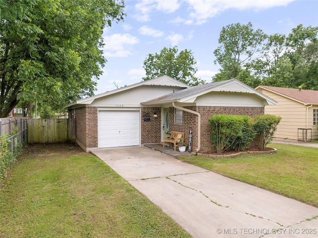 1604 9th Ave NW, Ardmore, OK 73401 - ranch-style house featuring brick siding, concrete driveway, and an attached garage