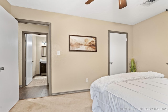 1604 9th Ave NW, Ardmore, OK 73401 - bedroom featuring light colored carpet and a ceiling fan