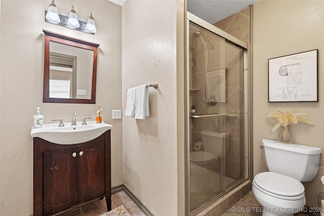 1604 9th Ave NW, Ardmore, OK 73401 - full bathroom with vanity, a stall shower, and tile patterned floors