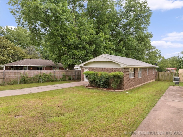 1604 9th Ave NW, Ardmore, OK 73401 - view of home's exterior featuring driveway and brick siding