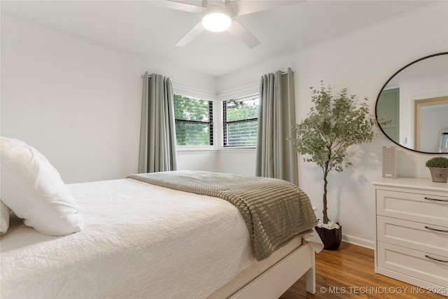 5914 E 26th St, Tulsa, OK 74114 - bedroom with wood finished floors and a ceiling fan