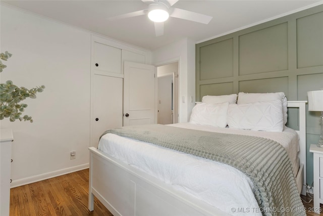 5914 E 26th St, Tulsa, OK 74114 - bedroom featuring wood finished floors and ceiling fan