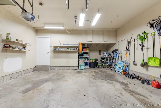 5914 E 26th St, Tulsa, OK 74114 - garage featuring a garage door opener