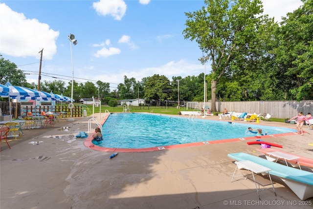 5914 E 26th St, Tulsa, OK 74114 - community pool featuring a patio area and view of scattered trees