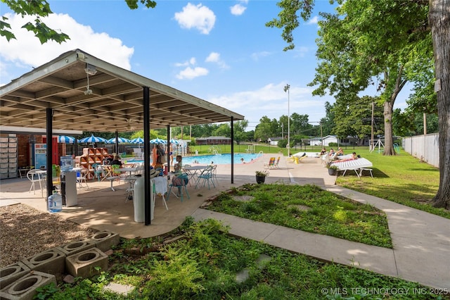 5914 E 26th St, Tulsa, OK 74114 - view of home's community with a swimming pool and a patio area
