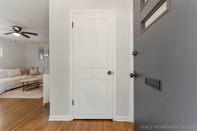 5914 E 26th St, Tulsa, OK 74114 - hallway featuring light wood-type flooring and baseboards
