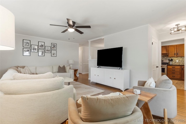 5914 E 26th St, Tulsa, OK 74114 - living area featuring a ceiling fan, wood finished floors, and crown molding