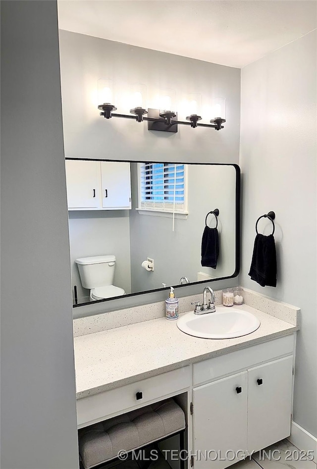 5914 E 26th St, Tulsa, OK 74114 - bathroom with vanity and toilet