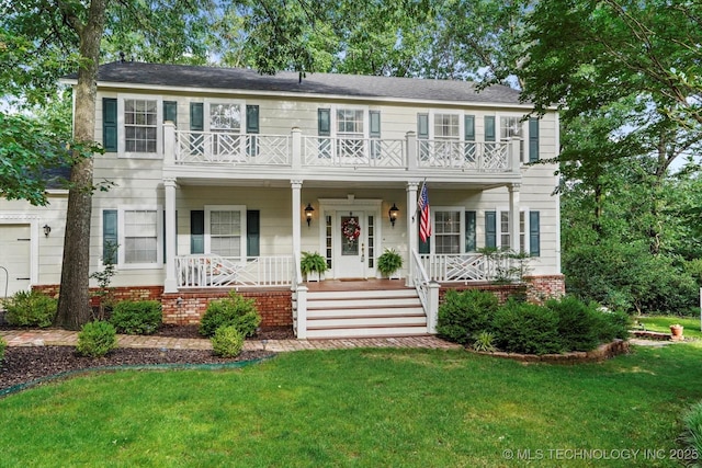1110 N Renaissance Dr, Sand Springs, OK 74063 - colonial inspired home with a balcony, covered porch, a front yard, and brick siding