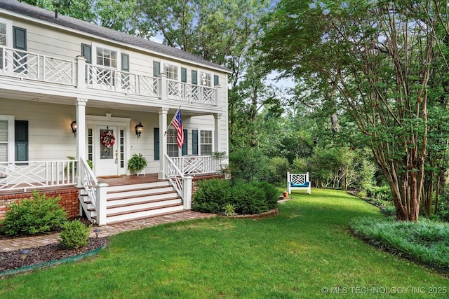 1110 N Renaissance Dr, Sand Springs, OK 74063 - view of front of property featuring a balcony, a porch, and a front lawn