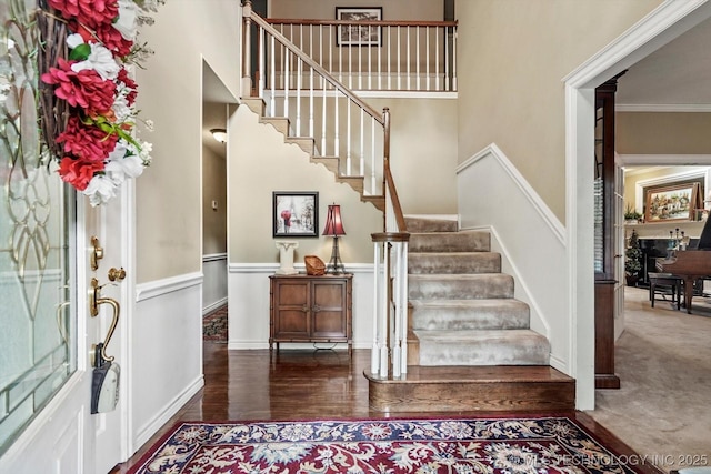 1110 N Renaissance Dr, Sand Springs, OK 74063 - entryway with a towering ceiling, stairway, and wainscoting
