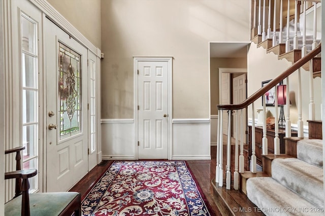 1110 N Renaissance Dr, Sand Springs, OK 74063 - foyer entrance featuring stairway, dark wood-style flooring, and a high ceiling
