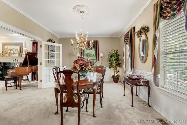 1110 N Renaissance Dr, Sand Springs, OK 74063 - dining space featuring a chandelier, light colored carpet, and ornamental molding