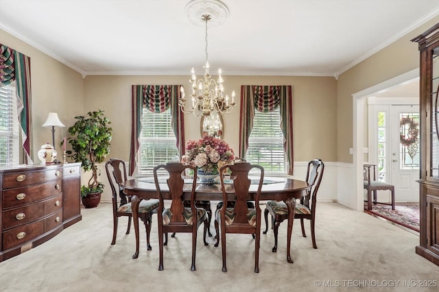 1110 N Renaissance Dr, Sand Springs, OK 74063 - dining space with light colored carpet, a chandelier, plenty of natural light, and crown molding