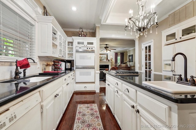 1110 N Renaissance Dr, Sand Springs, OK 74063 - kitchen featuring white appliances, ceiling fan, ornamental molding, dark wood-style flooring, and white cabinetry