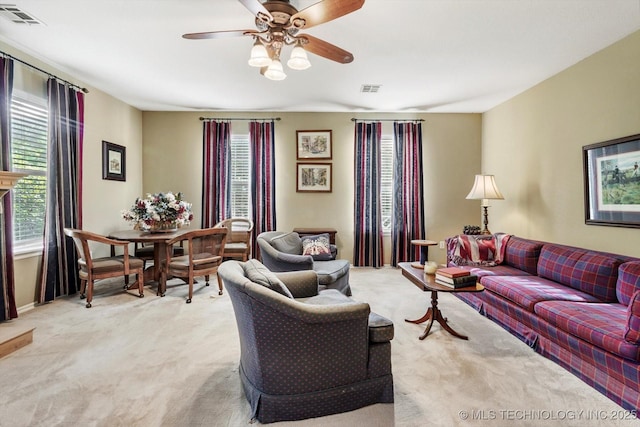 1110 N Renaissance Dr, Sand Springs, OK 74063 - living room with light colored carpet, plenty of natural light, and a ceiling fan