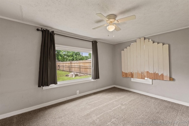 705 W Center St, Collinsville, OK 74021 - empty room featuring a ceiling fan, a textured ceiling, ornamental molding, and carpet floors