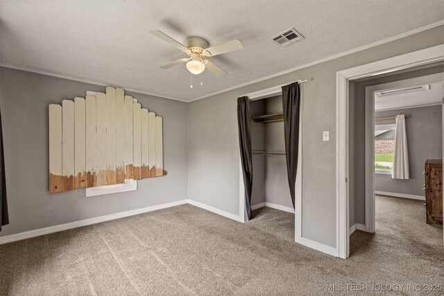 705 W Center St, Collinsville, OK 74021 - unfurnished bedroom with carpet flooring, a closet, ornamental molding, a ceiling fan, and a textured ceiling