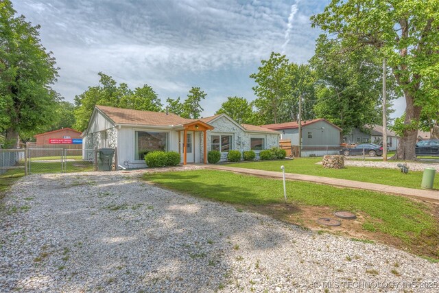 705 W Center St, Collinsville, OK 74021 - single story home featuring a gate and driveway