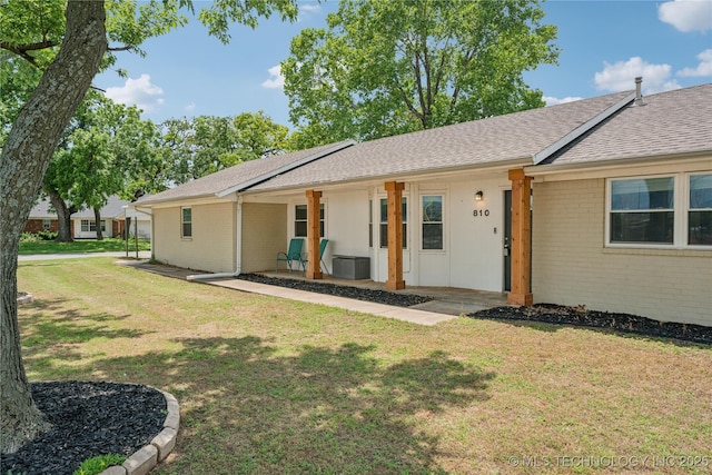 810 N 3rd St, Jenks, OK 74037 - rear view of property featuring brick siding, a lawn, roof with shingles, and covered porch