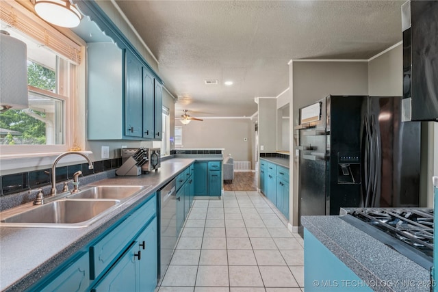 810 N 3rd St, Jenks, OK 74037 - kitchen with blue cabinets, black fridge with ice dispenser, dishwasher, light tile patterned floors, and a textured ceiling
