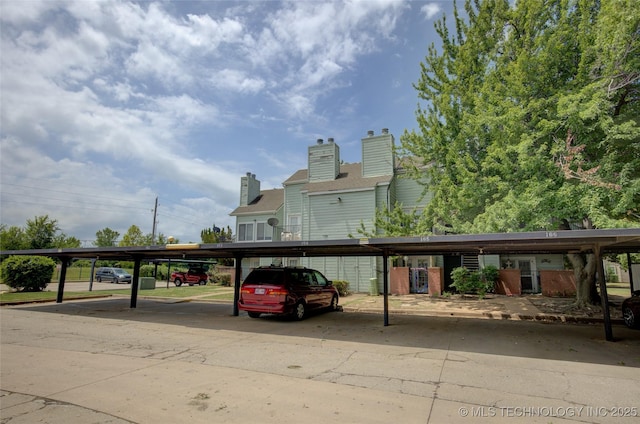 1730 E 67th St Unit K102, Tulsa, OK 74136 - view of covered parking lot