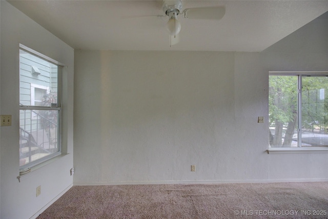 1730 E 67th St Unit K102, Tulsa, OK 74136 - carpeted empty room with a ceiling fan and baseboards