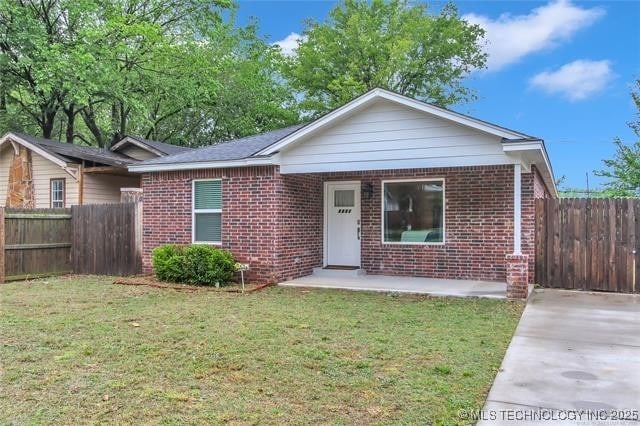 1332 N Denver Ave, Tulsa, OK 74106 - view of front facade with brick siding