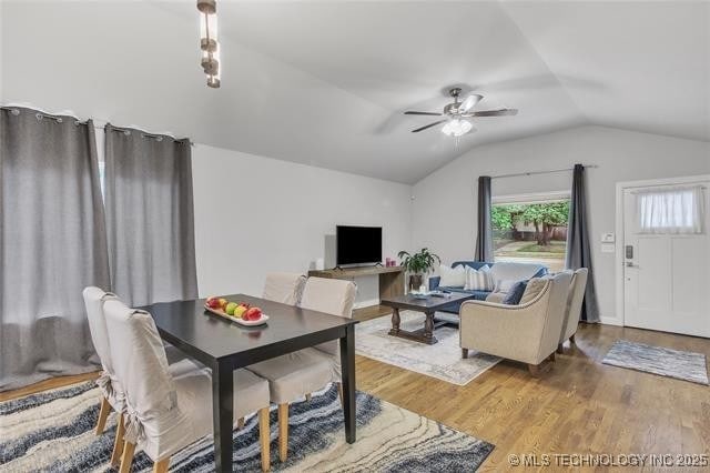 1332 N Denver Ave, Tulsa, OK 74106 - dining space featuring lofted ceiling, a ceiling fan, and wood finished floors