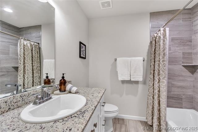 1332 N Denver Ave, Tulsa, OK 74106 - full bath with vanity and shower / bath combo with shower curtain