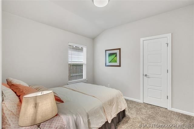 1332 N Denver Ave, Tulsa, OK 74106 - bedroom with vaulted ceiling and carpet floors