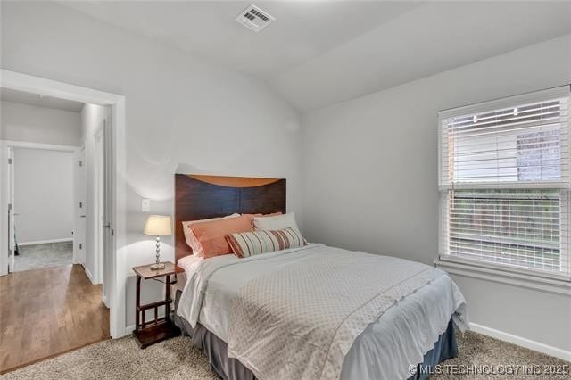 1332 N Denver Ave, Tulsa, OK 74106 - carpeted bedroom with baseboards and lofted ceiling