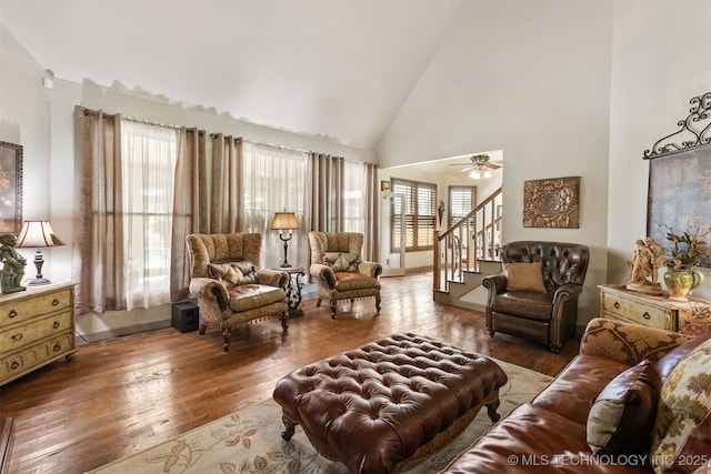 72878 S 230th Rd, Wagoner, OK 74467 - living room with wood-type flooring, stairway, high vaulted ceiling, and ceiling fan