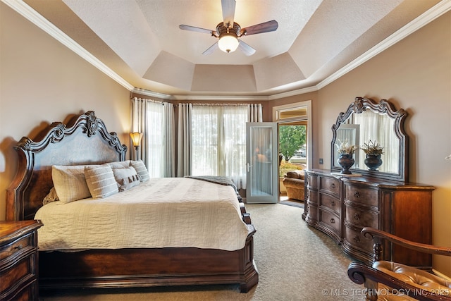 72878 S 230th Rd, Wagoner, OK 74467 - bedroom featuring a tray ceiling, access to outside, carpet floors, ceiling fan, and ornamental molding