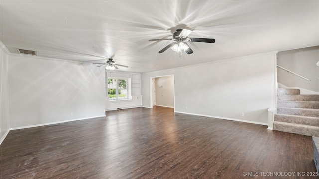 2974 E 77th Pl, Tulsa, OK 74136 - unfurnished living room featuring dark wood finished floors, ceiling fan, and stairs