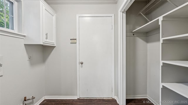 2974 E 77th Pl, Tulsa, OK 74136 - laundry room featuring baseboards and dark wood-type flooring