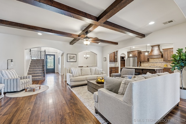 1956 E 172nd St S, Mounds, OK 74047 - living area with arched walkways, dark wood-style flooring, beam ceiling, recessed lighting, and stairway