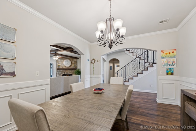 1956 E 172nd St S, Mounds, OK 74047 - dining area with arched walkways, coffered ceiling, crown molding, a chandelier, and dark wood-style floors